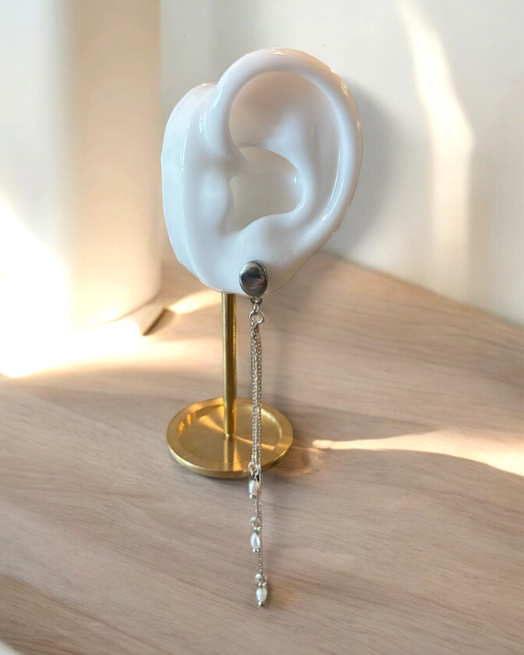 A falling earring silver long