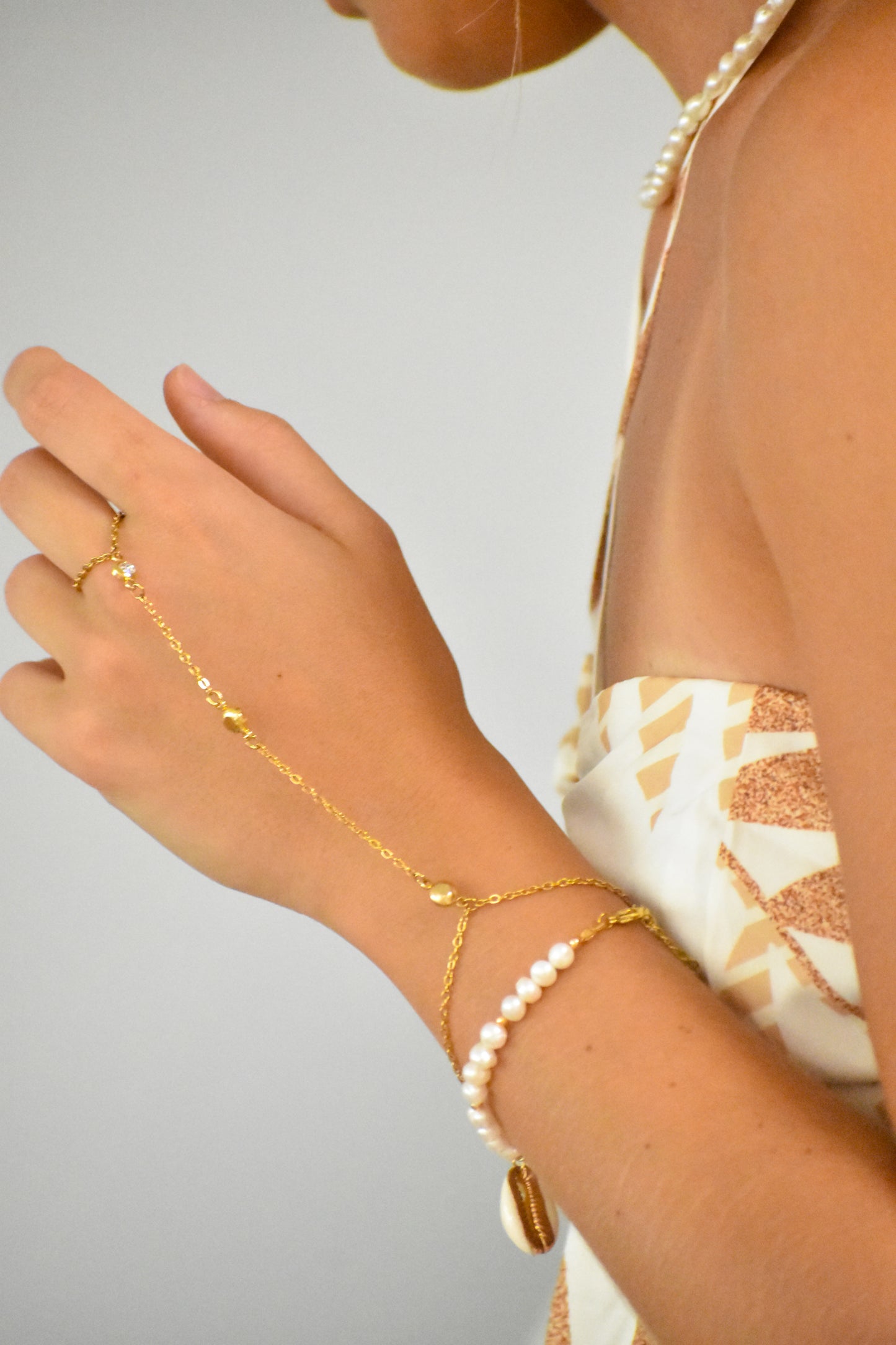 a bracelet with a ring attached