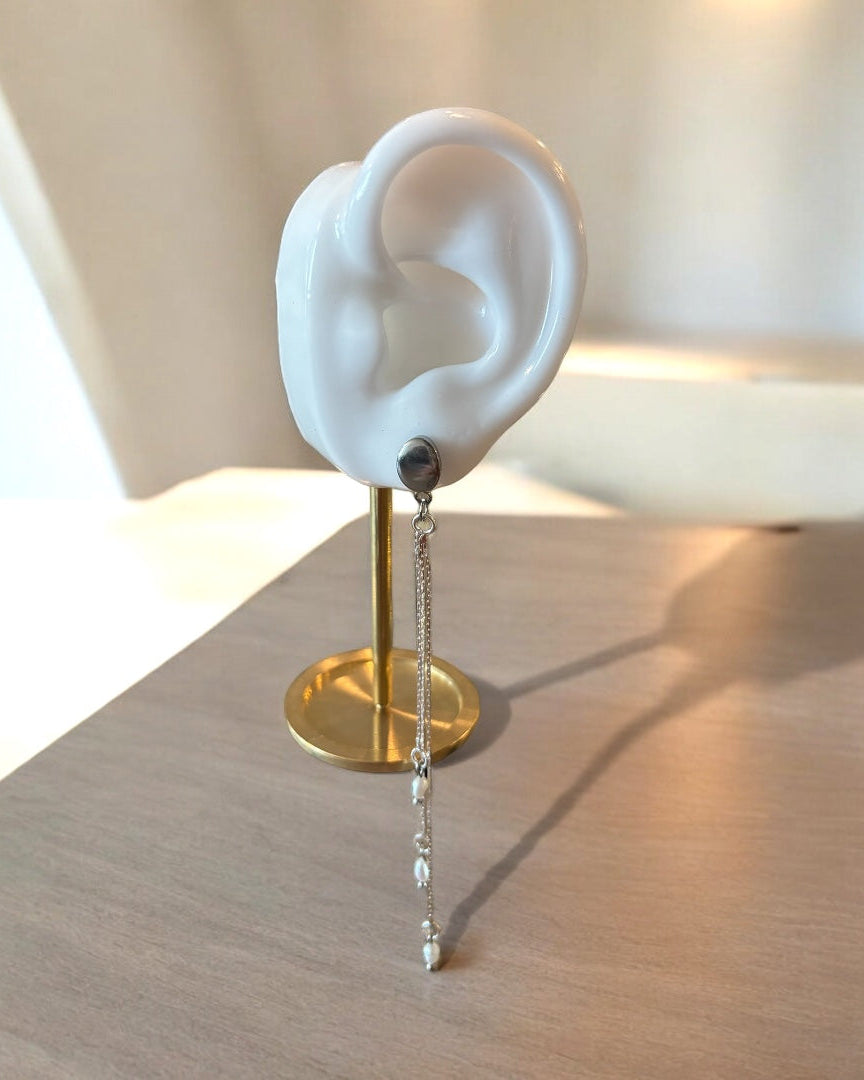 A falling earring silver long