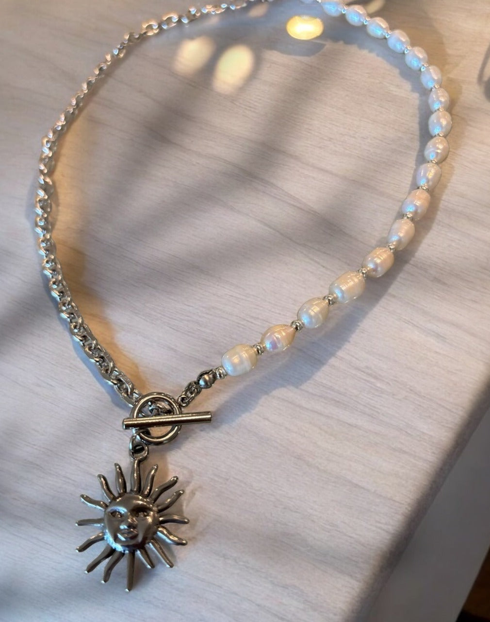 Half chain half pearls, with sun silver pendant